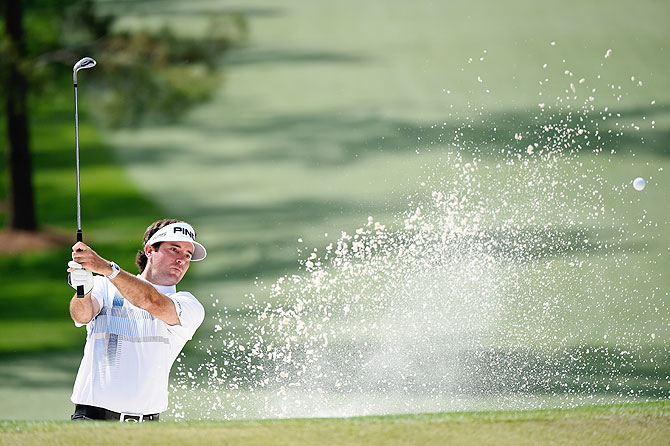 Bubba Watson of the United States plays a bunker shot on the seventh hole during the final round of the 2014 Masters Tournament at Augusta National Golf Club on Sunday