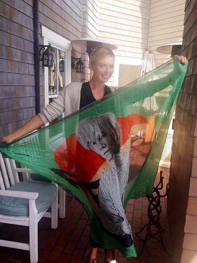 Maria Sharapova with a flag with a picture of artist Andy Warhol