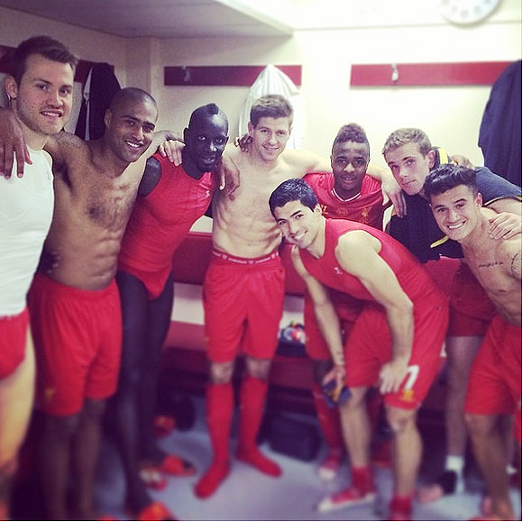 Liverpool players celebrate in the dressing room after their win over Manchester City on Sunday
