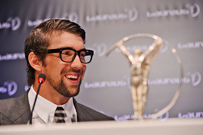Michael Phelps with his award for 'Laureus Academy Exceptional Acheivement Award' during the 2013 Laureus World Sports Awards in Rio de Janeiro on March 11, 2013