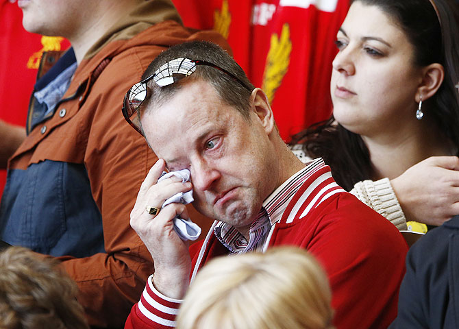 A man weeps during a memorial service to mark the 25th anniversary of the Hillsborough disaster at Anfield in Liverpool on Tuesday