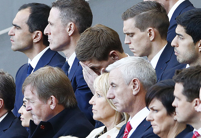 Liverpool's captain Steven Gerrard (centre) reacts during a memorial service to mark the 25th anniversary of the Hillsborough disaster at Anfield on Tuesday