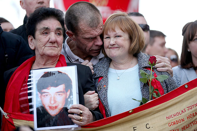 Family members of a victim of the disaster also part of the Hillsborough Justice Campaign group march to Anfield for a memorial service marking the 25th anniversary of the Hillsborough Disaster at Anfield stadium on Tuesday