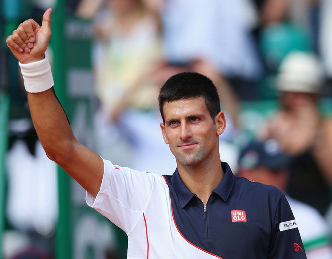 Novak Djokovic of Serbia thanks the support after defeating Albert Montanes of Spain