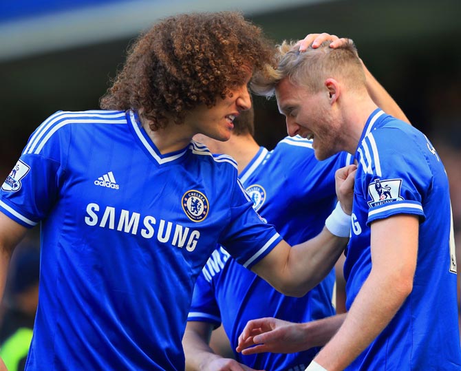 Andre Schurrle (right) celebrates scoring the second goal for Chelsea with team mate David Luiz