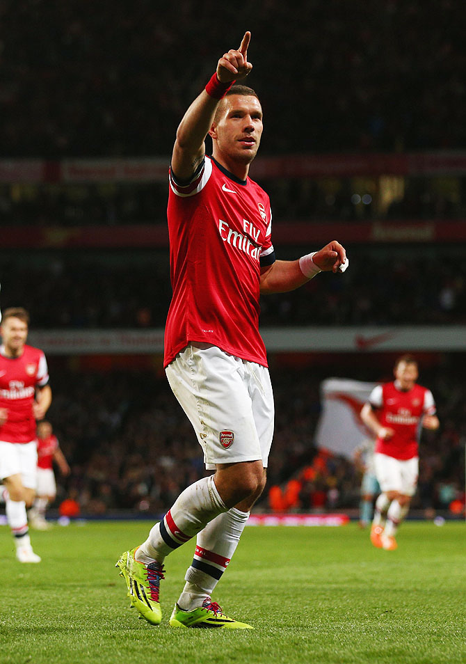 Arsenal's Lukas Podolski celebrates after scoring against West Ham United