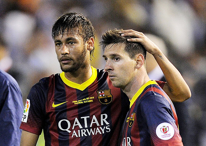 Lionel Messi (right) and Neymar of FC Barcelona react after the Copa del Rey King's Cup final on Wednesday