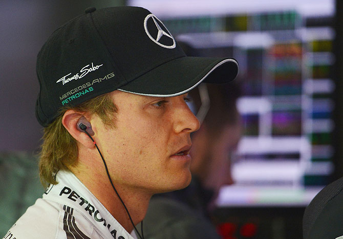 Nico Rosberg of Germany and Mercedes GP looks on during final practice ahead of the Chinese Formula One Grand Prix at the Shanghai International Circuit on Saturday