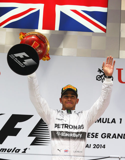 Lewis Hamilton of Great Britain and Mercedes GP celebrates his victory at the Shanghai International Circuit