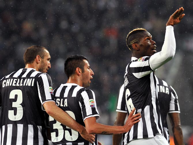 Paul Pogba (right) of Juventus celebrates after scoring the opening goal against Bologna