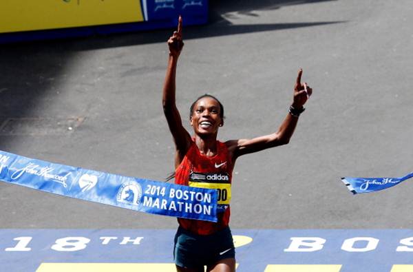 Rita Jeptoo of Kenya crosses the finish line to win the 118th Boston Marathon