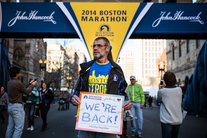 Bill Sved, who says he ran the Boston Marathon last year and is running again this year, poses for a portrait at the finish line of the Boston Marathon on April 19, 2014.