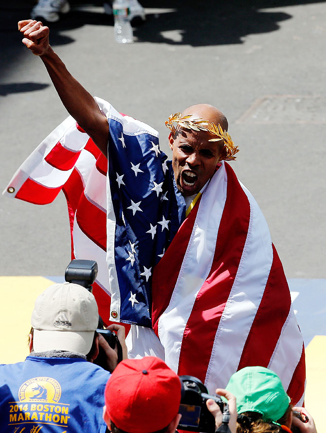 Meb Keflezighi of the United States celebrates after winning the 118th Boston Marathon on Monday