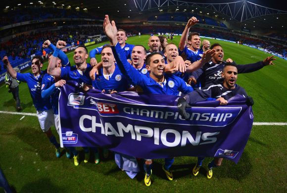 Leicester City players celebrate after winning the title