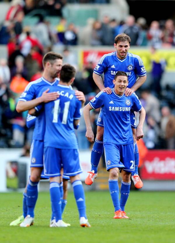 Chelsea players celebrate their 1-0 victory over Swansea City in the Barclays Premier League match at Liberty Stadium on April 13.