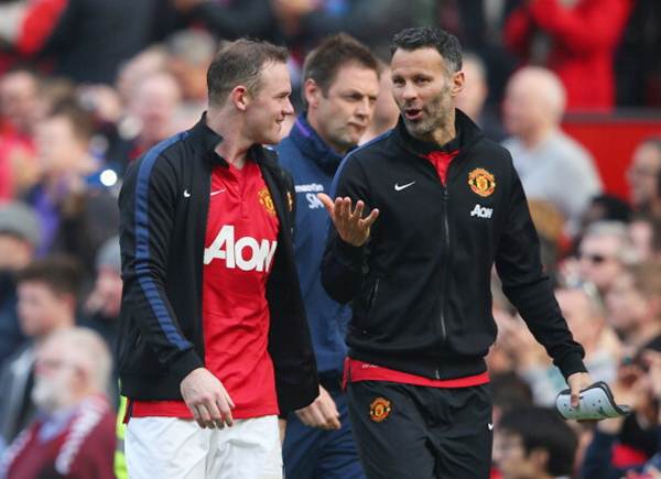 Manchester United's Wayne Rooney walks off with Ryan Giggs (right) at the end of the Barclays Premier League match against Aston Villa at Old Trafford on March 29.