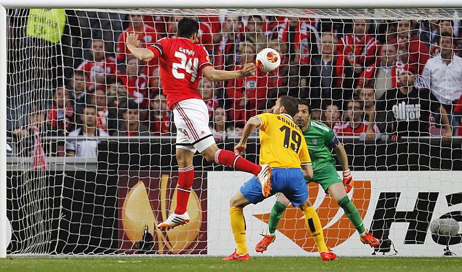 Benfica's Ezequiel Garay (left) heads to score near Juventus's Leonardo Bonucci during their Europa League semi-final first leg match at Luz stadium in Lisbon on Thursday