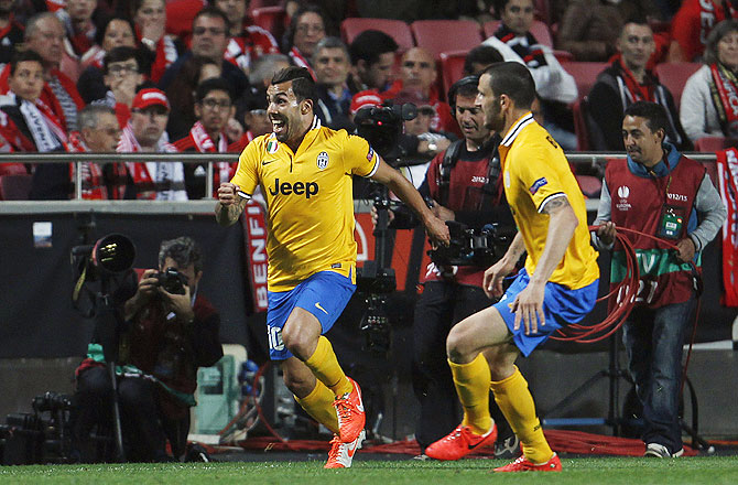 Juventus's Carlos Tevez (left) celebrates his goal against Benfica during their Europa League semi-final first leg match at Luz stadium in Lisbon on Thursday