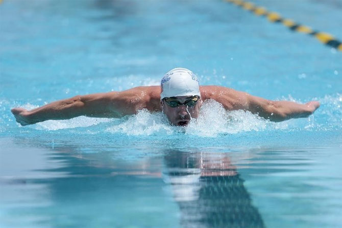 Michael Phelps swims during the men's 100m butterfly race at the 2014 USA Swimming Grand Prix Series at Skyline Aquatic Center on Thursday