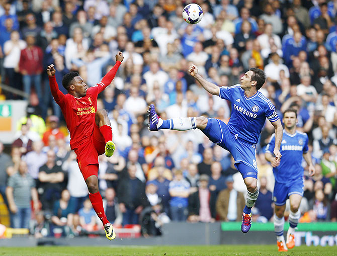 Liverpool's Daniel Sturridge (left) challenges Chelsea's Frank Lampard during their match on Sunday