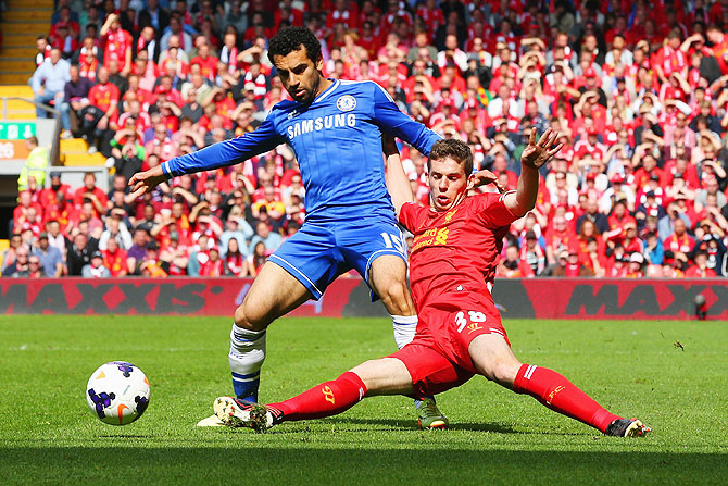 Mohamed Salah of Chelsea is tackled by Jon Flanagan of Liverpool during their match on Sunday