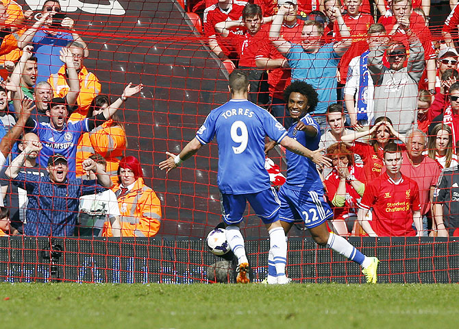 Chelsea's Willian (right) celebrates with teammate Fernando Torres after scoring a goal against Liverpool on Sunday