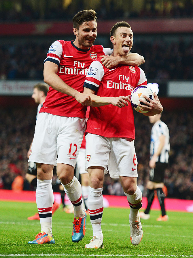 Laurent Koscielny of Arsenal celebrates wth Olivier Giroud (left) after scoring against Newcastle United during their English Premier League match at Emirates Stadium in London, England on Monday