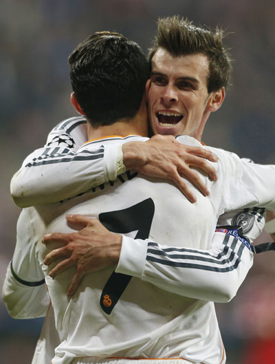 Real Madrid's Cristiano Ronaldo celebrates with Gareth Bale (right) after scoring a goal against Bayern Munich