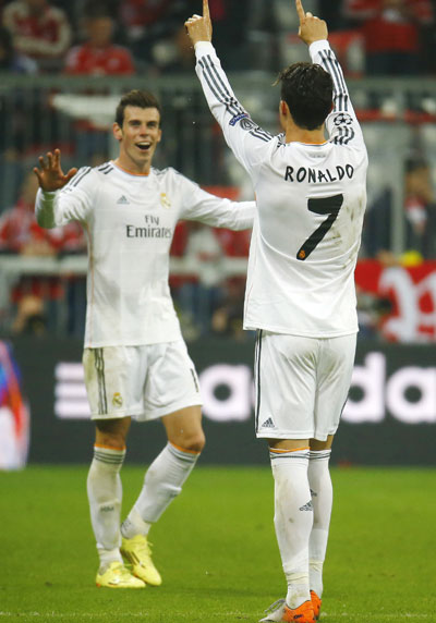 Real Madrid's Cristiano Ronaldo (right) celebrates his second goal against Bayern Munich with teammate Gareth Bale