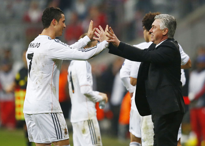 Real Madrid's Cristiano Ronaldo celebrates with coach Carlo Ancelotti
