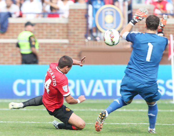 Javier 'Chicharito' Hernandez scores Manchester United's third goal past Real keeper Iker Casillas