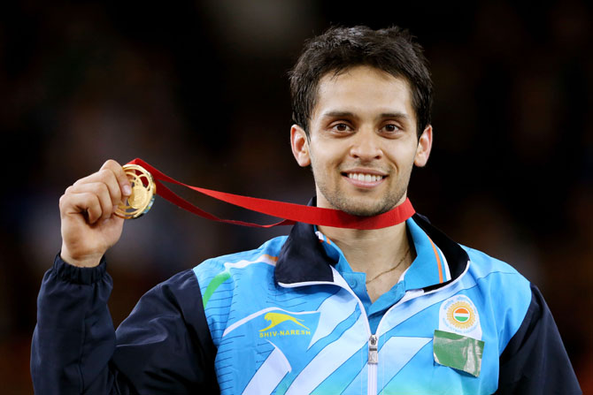 Gold medalist Kashyap Parupalli of India poses in the medal ceremony