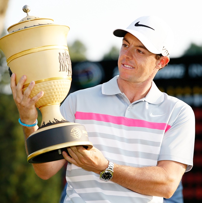 Rory McIlroy of Northern Ireland holds the Gary Player Cup trophy after winning the World Golf Championships-Bridgestone Invitational