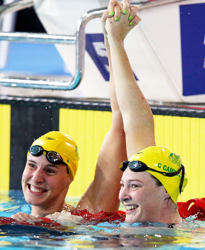 Cate Campbell, right, of Australia celebrates winning the gold medal with silver medallist and her sister Bronte Campbell