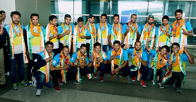 Members of the Indian Hockey team at a photo-op on their arrival at the IGI Airport in New Delhi on Tuesday following their arrival from the Commonwealth Games in Glasgow