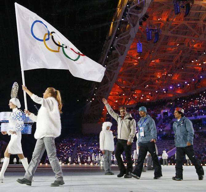 Independent Olympic Indian participants walk at the 2014 Sochi Winter Olympics opening ceremony with the Olympic flag ahead