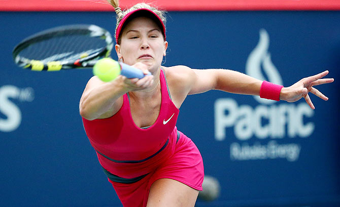 Eugenie Bouchard of Canada returns a shot to Shelby Rogers of the USA during Rogers Cup at Uniprix Stadium in Montreal, Canada, on Tuesday