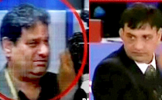 TV grab of Indian officials Rajeev Mehta (left) and Virender Malik