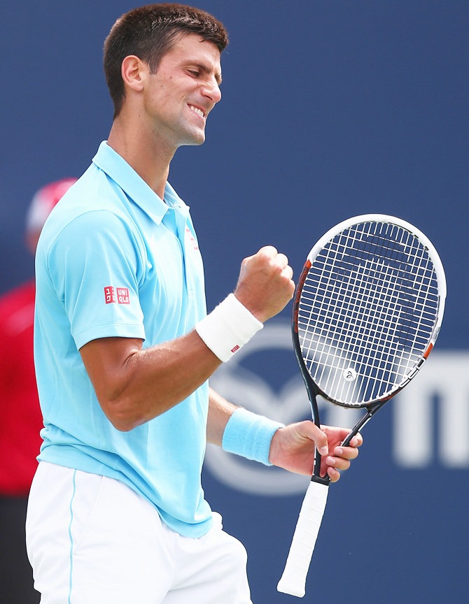 Novak Djokovic of Serbia celebrates a game against Gael Monfils of France during Rogers Cup at Rexall Centre at York University