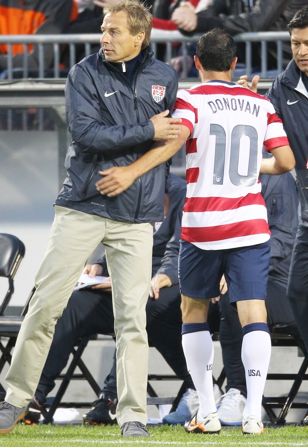 Head coach Jurgen Klinsmann of USA congratulates Landon Donovan