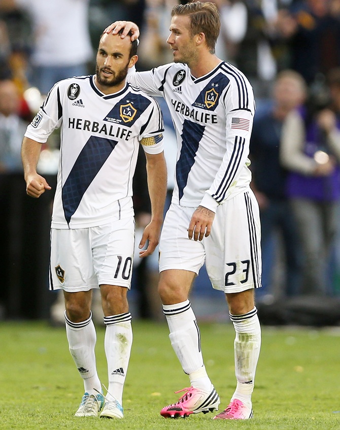 Landon Donovan and David Beckham of Los Angeles Galaxy react