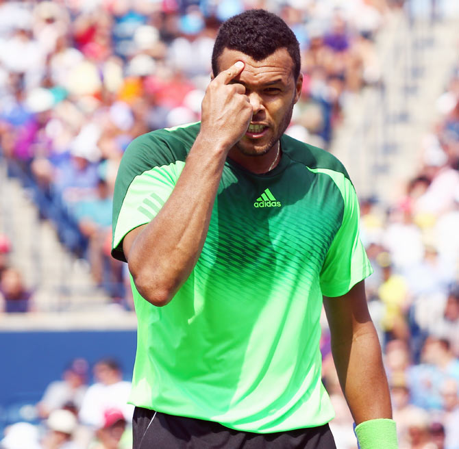 Jo-Wilfried Tsonga of France reacts after a point against Andy Murray of Great Britain in the quarter-finals on Friday