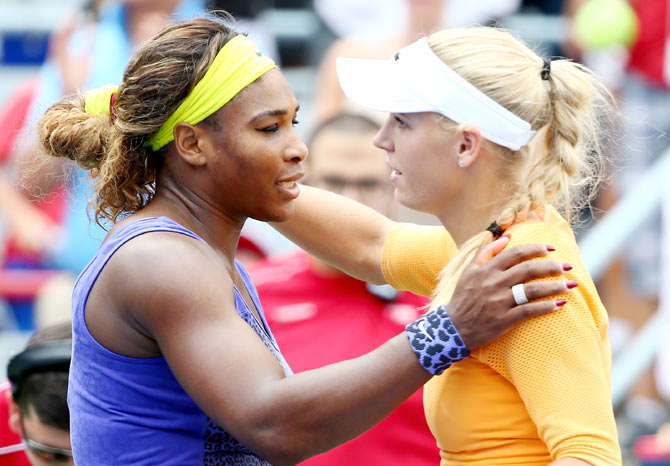 Serena Williams of the USA hugs Caroline Wozniacki of Denmark after their quarter-final match on Friday