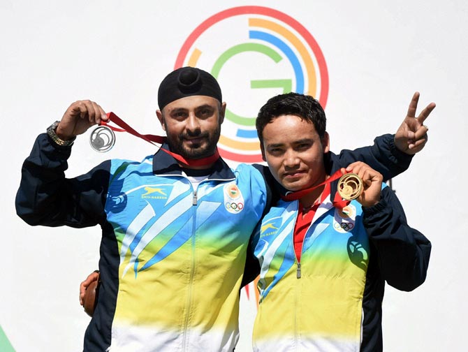 Jitu Rai (right) and Gurpal Singh of India celebrate after winning the gold and silver medal at Commonwealth Games in Glasgow