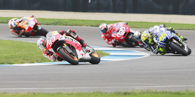 Honda MotoGP rider Marc Marquez (93) of Spain leads other riders through a turn during the Indianapolis GP on Sunday
