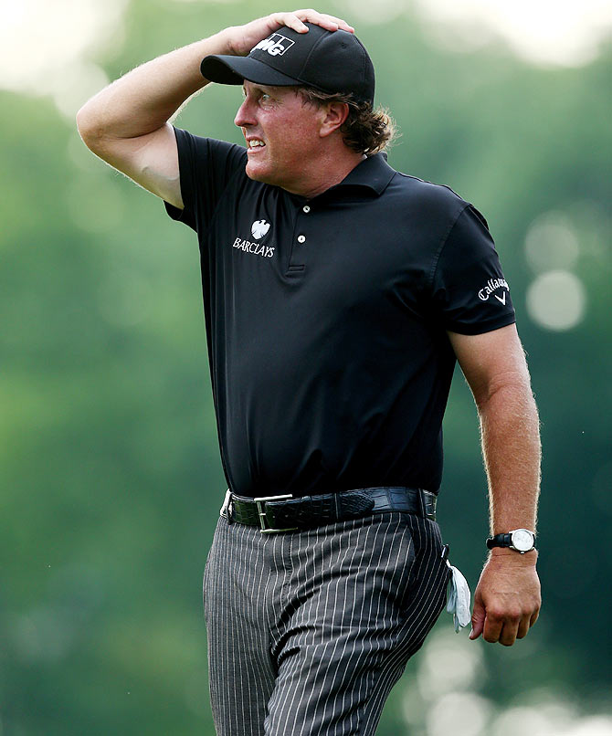 Phil Mickelson of the United States reacts on the tenth green during the final round of the 96th PGA Championship at Valhalla Golf Club on Sunday