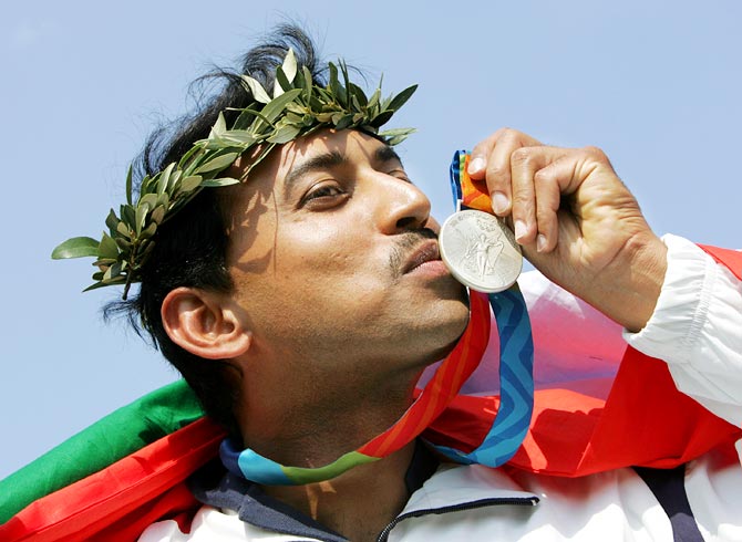 Rajyavardhan Singh Rathore celebrates after winning the silver medal at the 2004 Olympic Games in Athens, on August 17, 2004