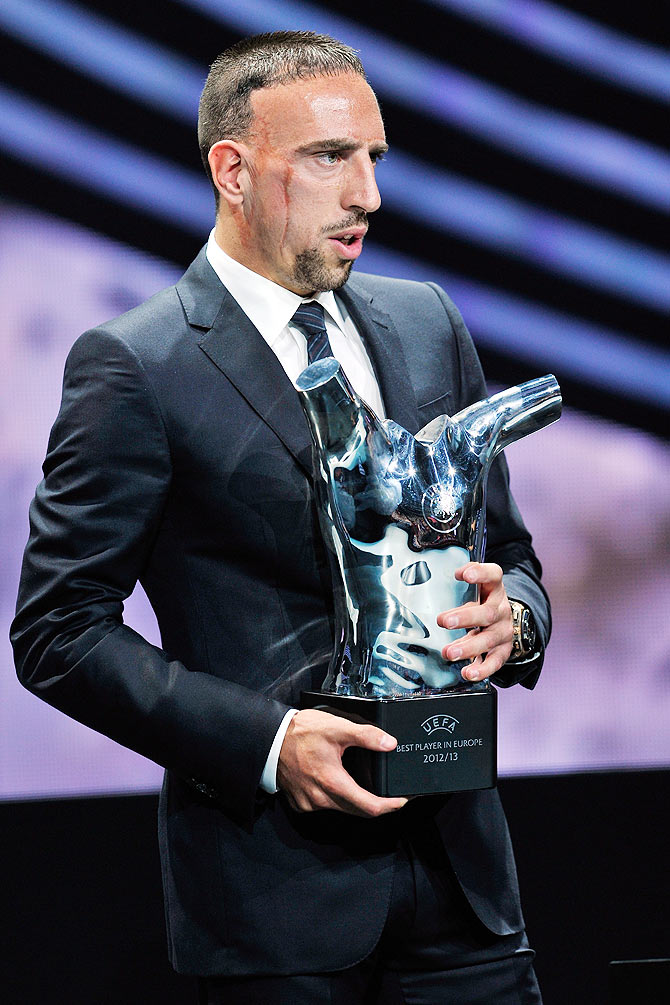 Franck Ribery holds the Best Player in Europe trophy during the UEFA Champions League group stage 2013/14 draw on August 29, 2013 in Monaco