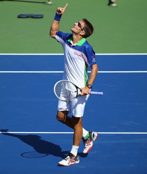Tommy Robredo of Spain celebrates after beating Novak Djokovic of Serbia on Day 6 at the Western & Southern Open