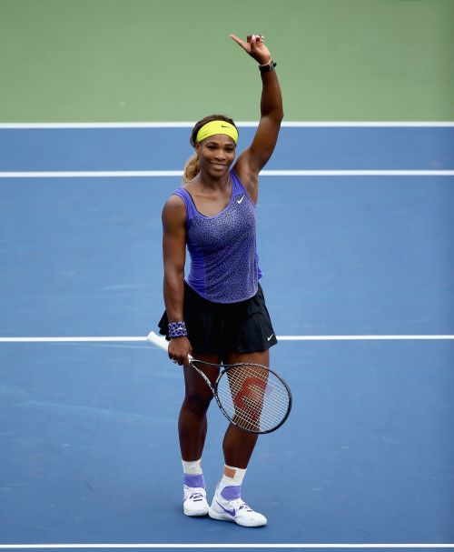 Serena Williams celebrates after beating Flavia Pennetta of Italy 